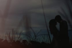Dreamy Silhouette Engagement Portrait In Louisiana Field At Sunset