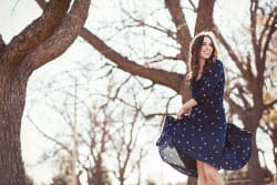 Fashion Blogger Twirling Anthropologie Dress In Woods