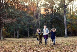 Girls Running Through Autumn Louisiana Woods